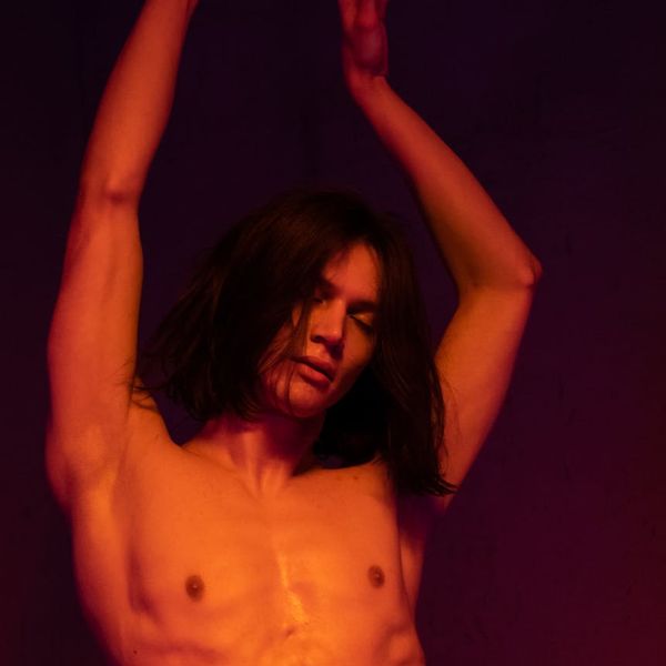 Person performing a fluid, dance-like cardio movement.